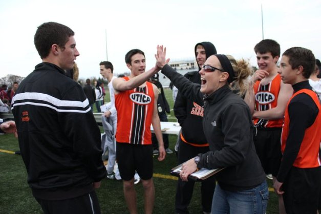 Celebrate success! I high-five a few of my track athletes after a successful race.